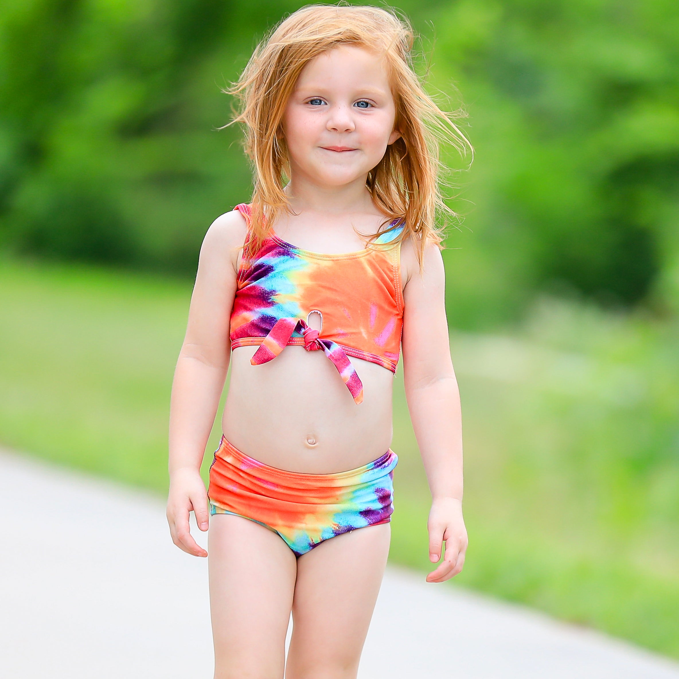 AL Limited Girls 2 piece Tie Dye Tankini Swimsuit featuring a rainbow swirl design with a tie knot tank top and high-waisted bottoms.